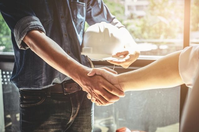 Contractor shaking hands with homeowner